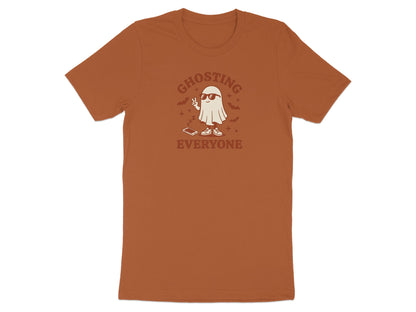 Brown t-shirt with a ghost wearing sunglasses and peace sign.
