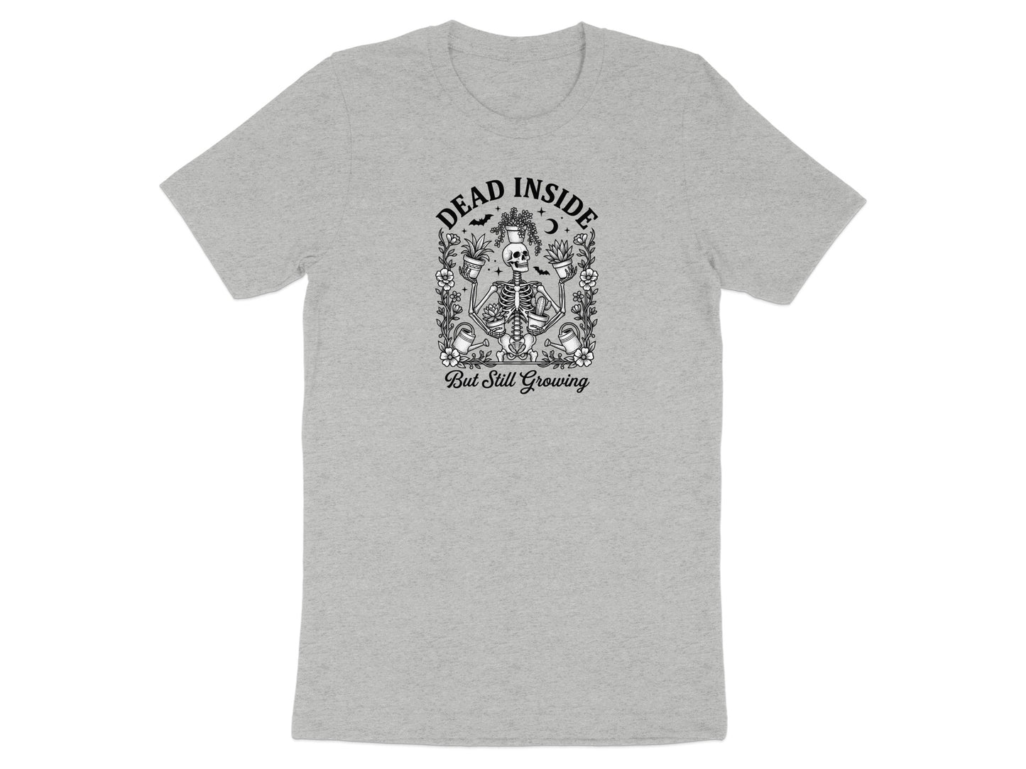 Grey t-shirt with skeleton holding plants and text "DEAD INSIDE But Still Growing".