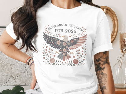 White t-shirt with eagle graphic and "250 Years of Freedom 1776-2026" text.