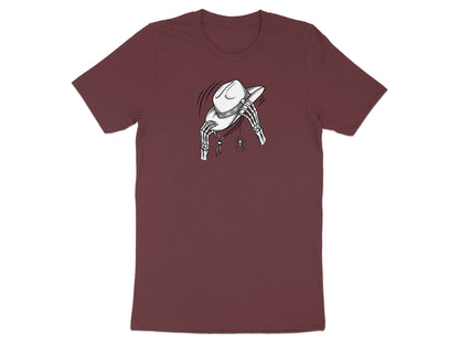 Skeleton hands hold a cowboy hat above a hanging spider on a burgundy t-shirt.