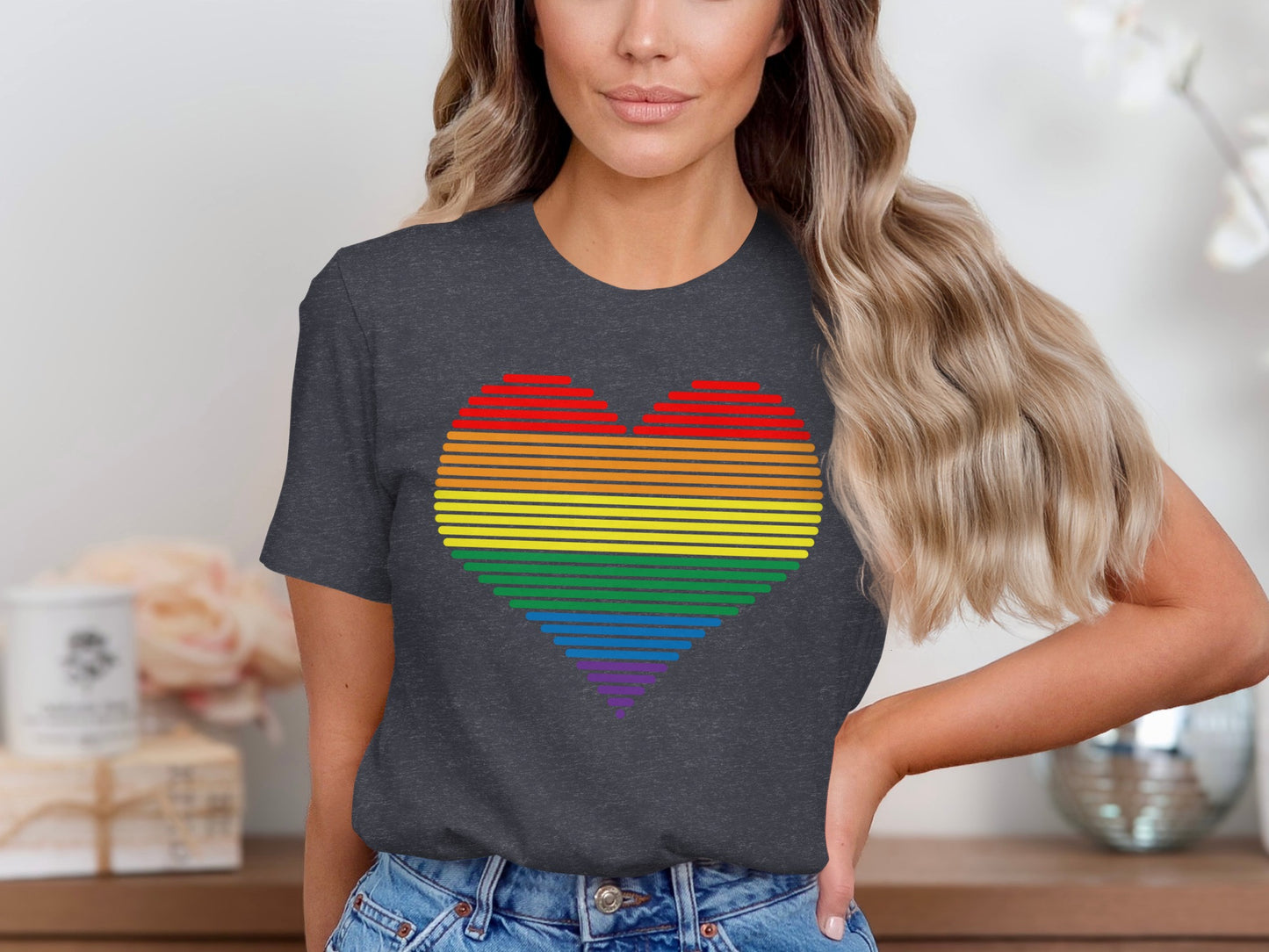 Dark grey t-shirt with rainbow heart graphic.