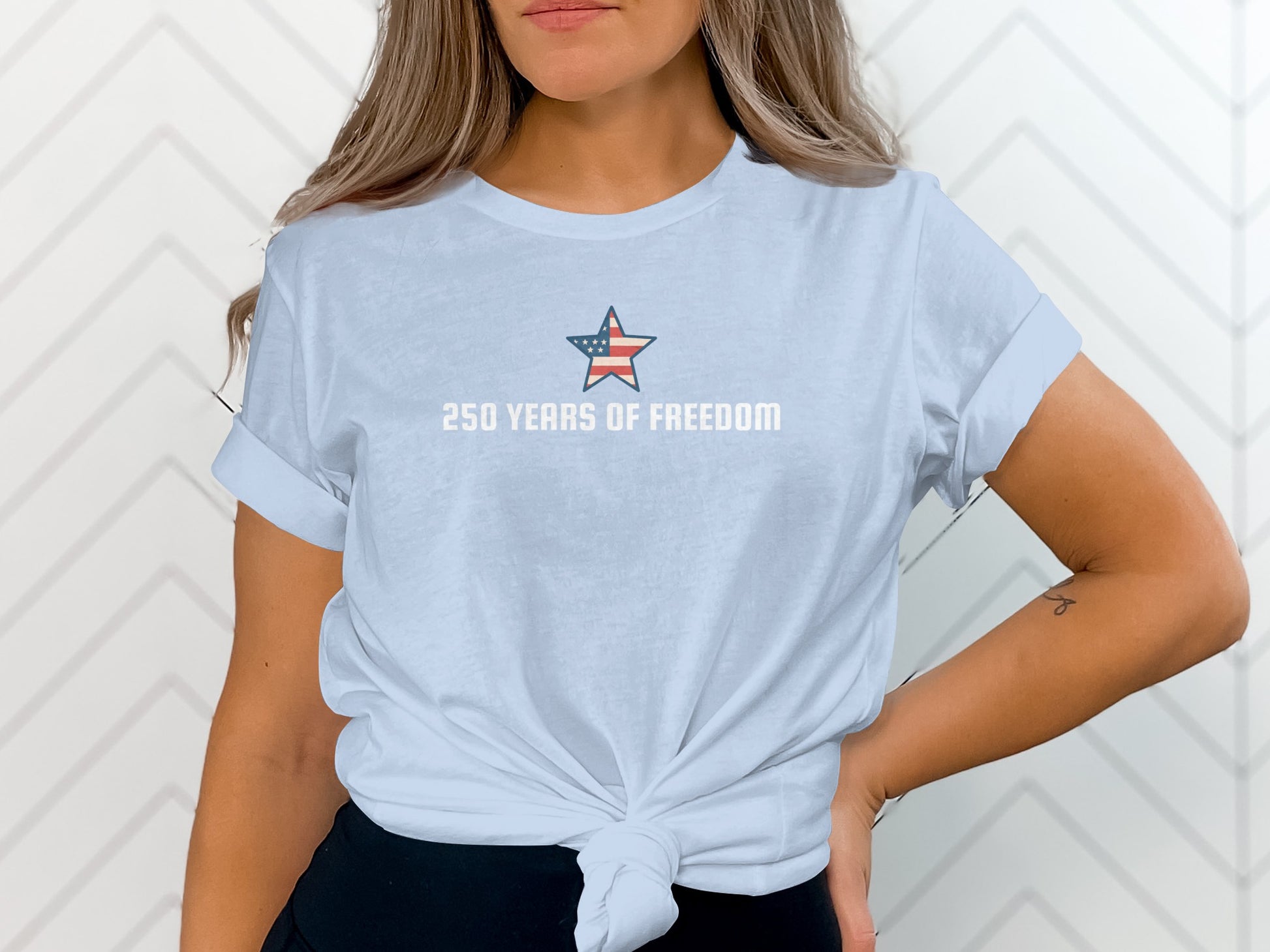 Light blue t-shirt with "250 Years of Freedom" and a small American flag star.