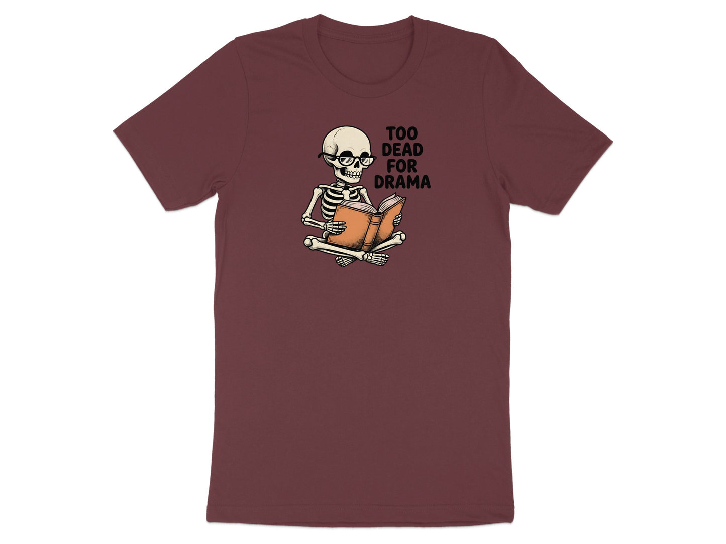 Skeleton wearing glasses reading a book with "Too Dead For Drama" text.