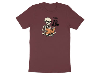 Skeleton wearing glasses reading a book with "Too Dead For Drama" text.