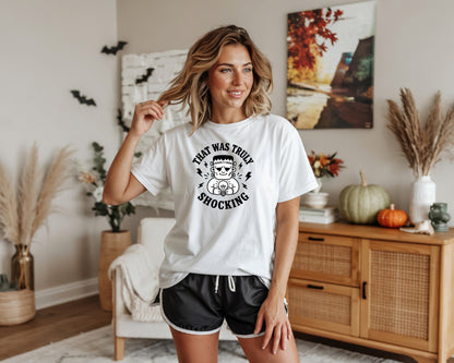 White t-shirt with Frankenstein and text "That Was Truly Shocking."