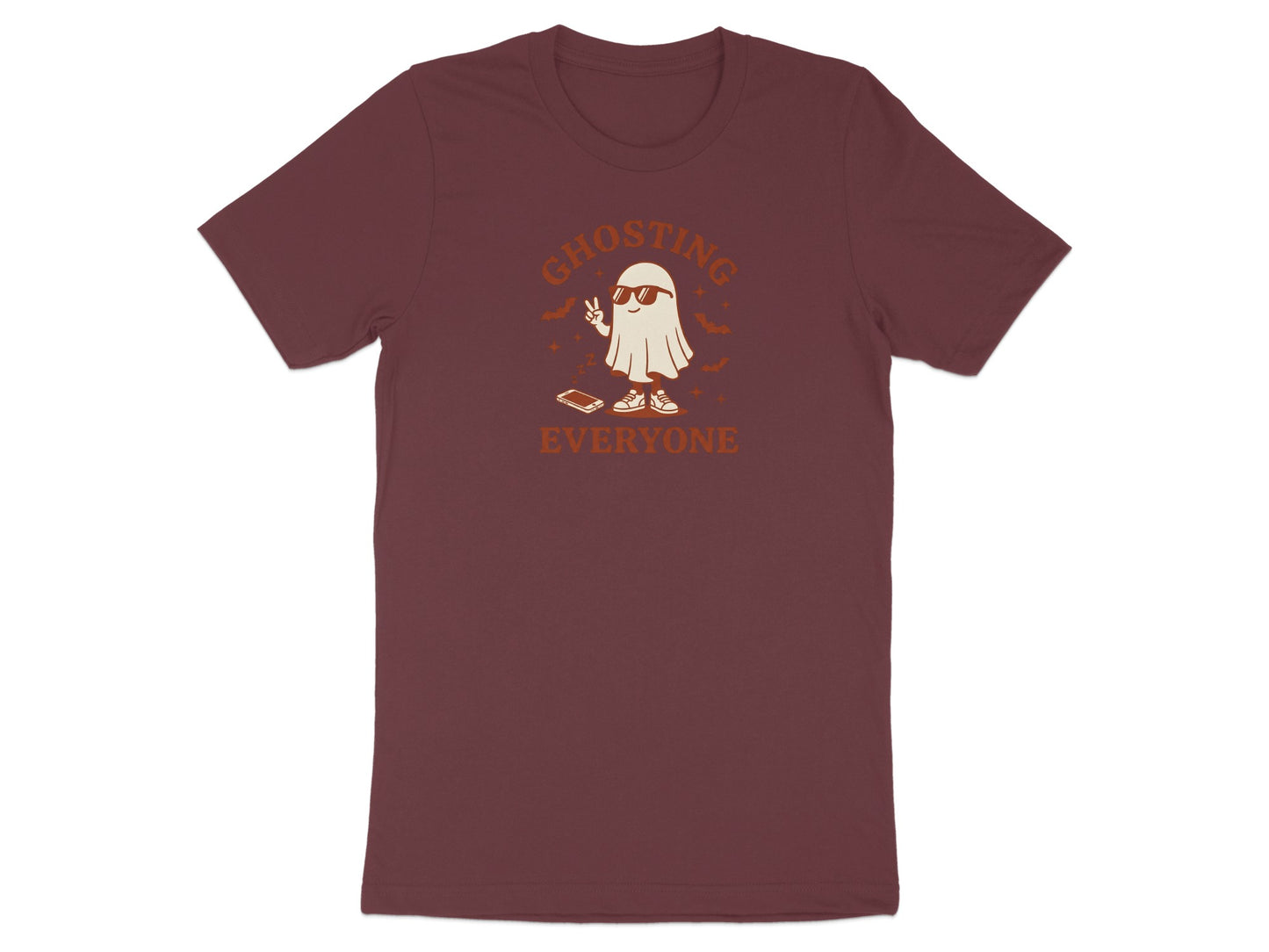 Maroon t-shirt with a ghost giving peace sign and wearing sunglasses, text "GHOSTING EVERYONE".