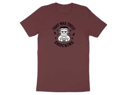 T-shirt with Frankenstein holding a lightbulb and text "THAT WAS TRULY SHOCKING".