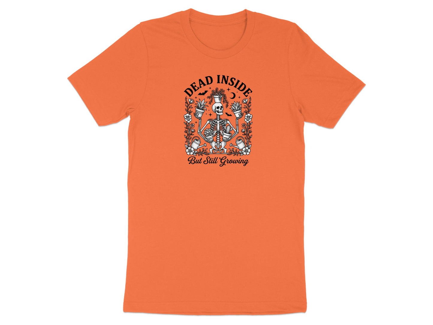 Orange t-shirt with skeleton holding plants and text "DEAD INSIDE But Still Growing".