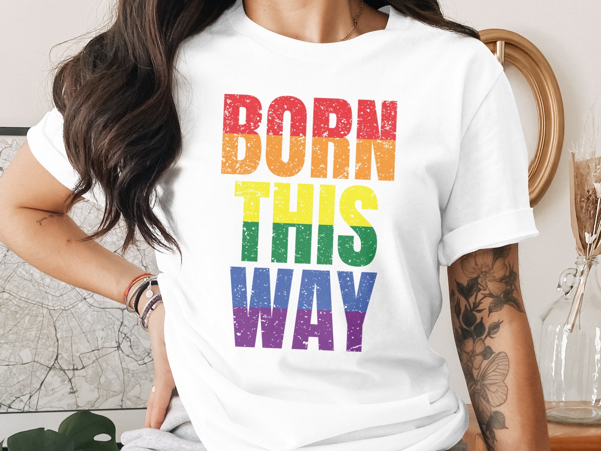 White t-shirt with "BORN THIS WAY" in rainbow lettering.