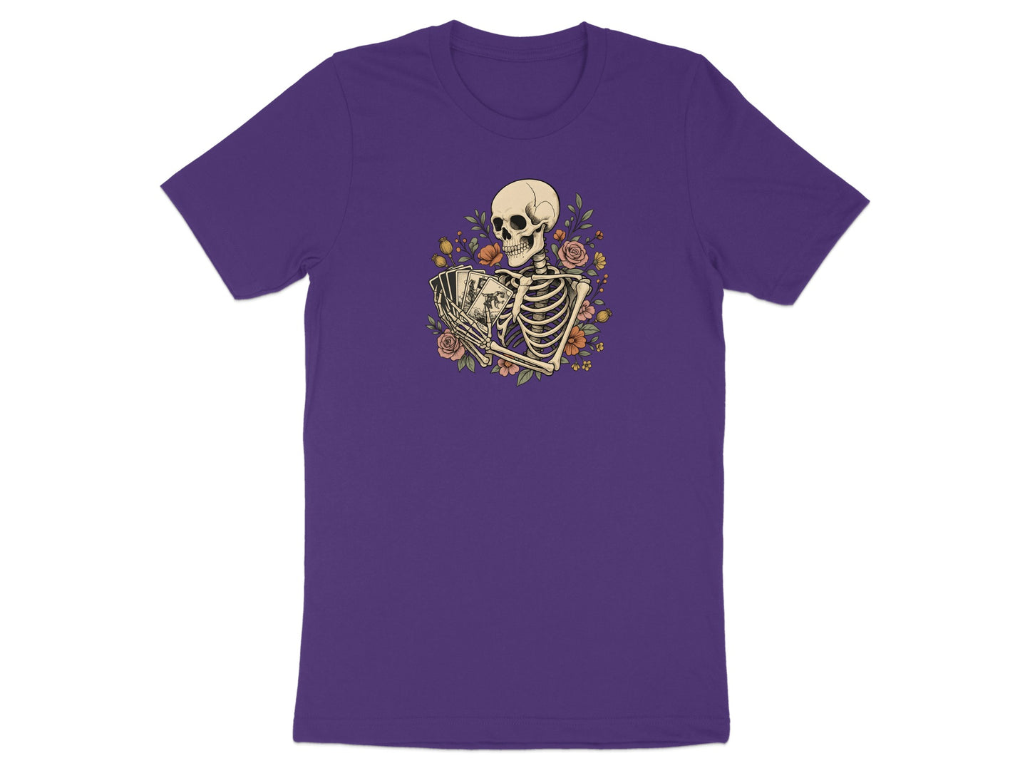 Skeleton holding playing cards surrounded by flowers on a purple t-shirt.