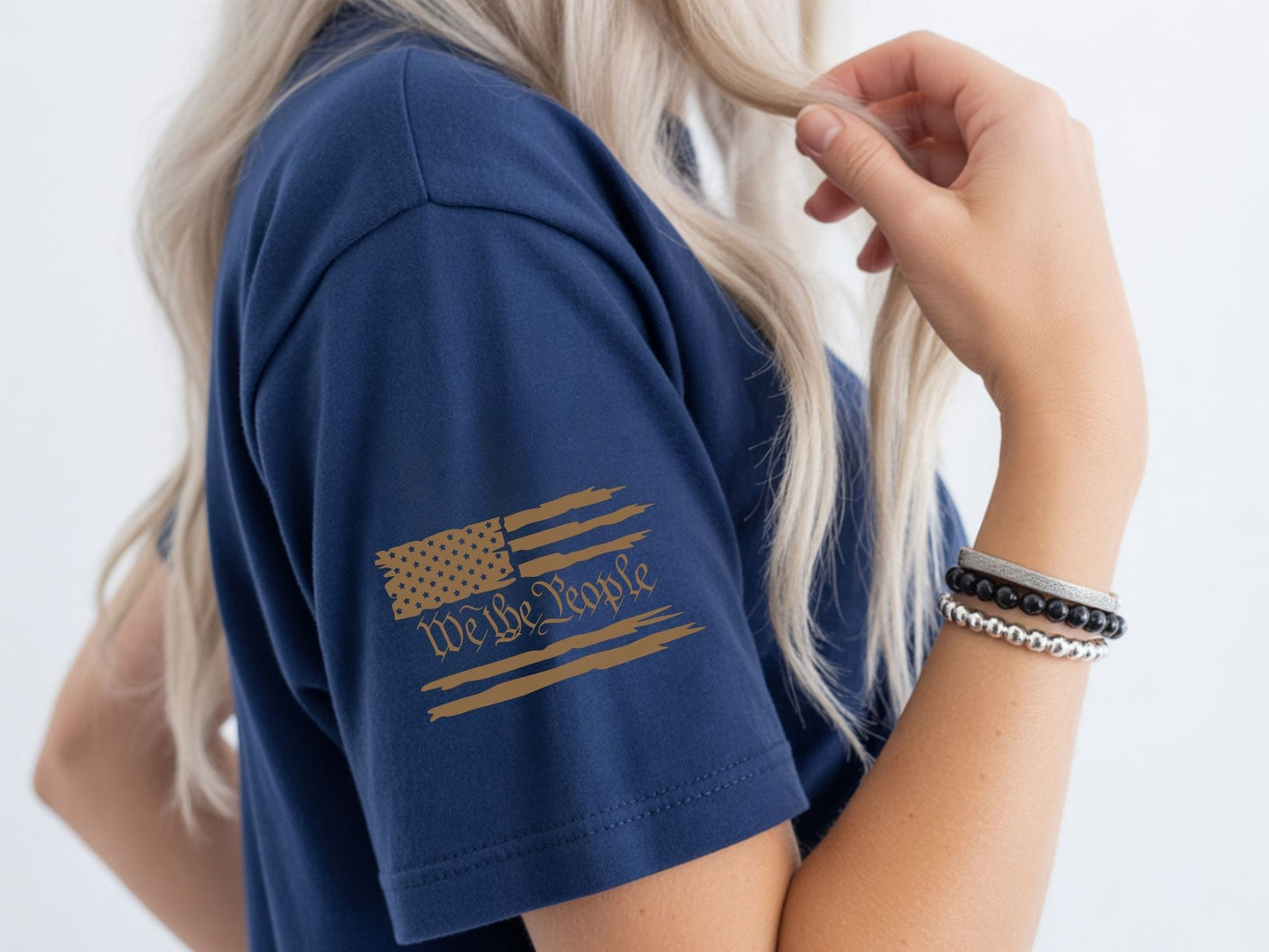 Navy t-shirt with distressed American flag and "We The People" text on sleeve.