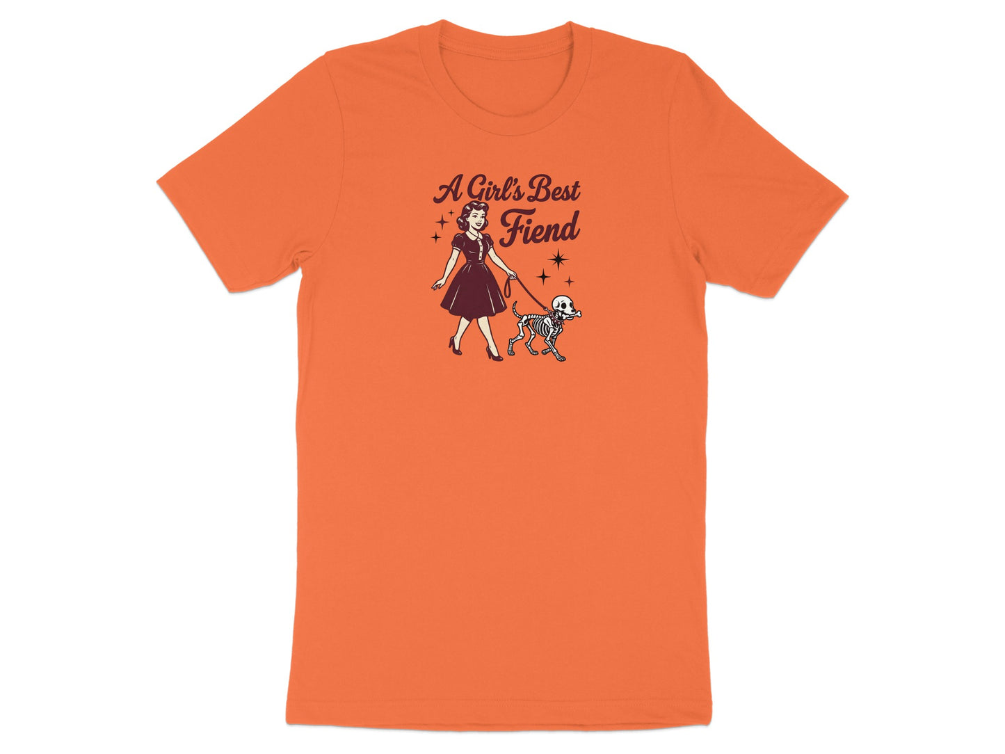 Orange t-shirt with "A Girl's Best Fiend" text and graphic of woman walking skeleton dog.