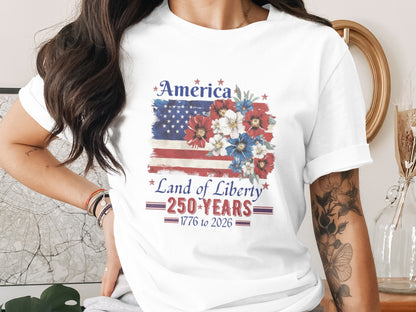 T-shirt with American flag and flowers, "America Land of Liberty 250 Years 1776 to 2026".