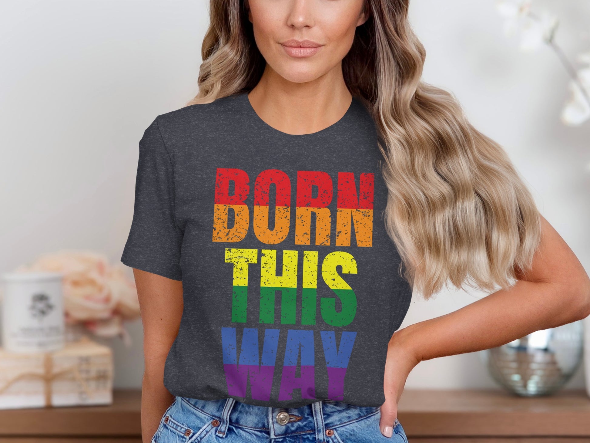 Dark t-shirt with rainbow text that reads "Born This Way".
