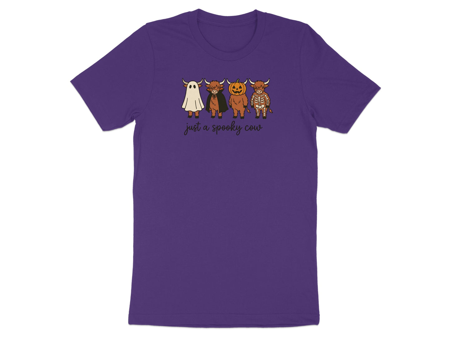 Purple t-shirt with a graphic of four Highland cows dressed for Halloween and the text "just a spooky cow".