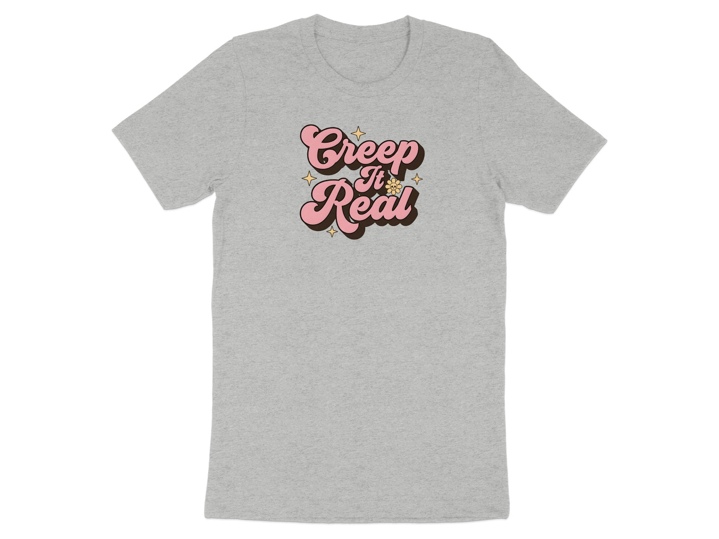 Grey t-shirt with pink "Creep It Real" text and yellow stars.