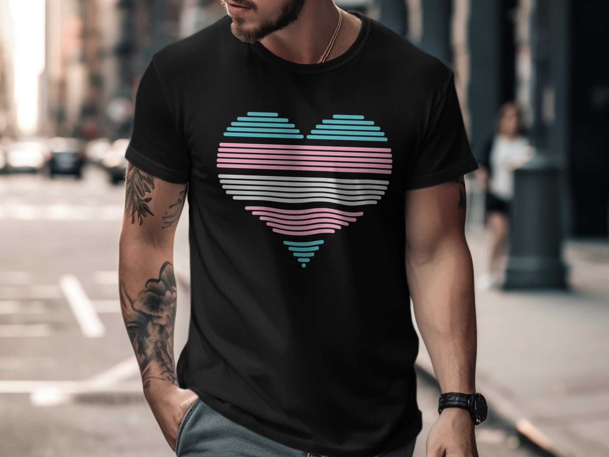 Black t-shirt with a heart-shaped transgender pride flag design.