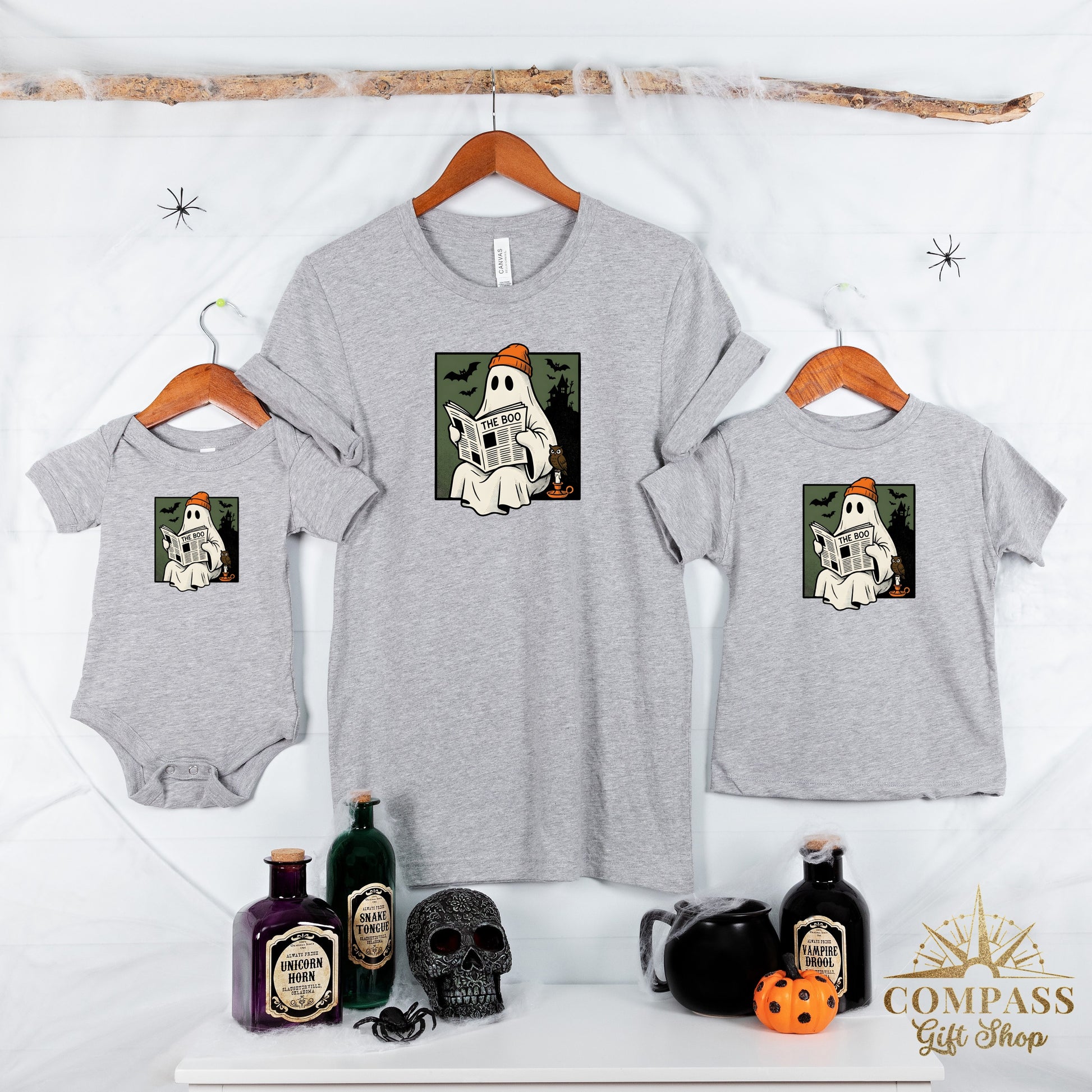 Three grey t-shirts with a ghost reading "The Boo" newspaper graphic.