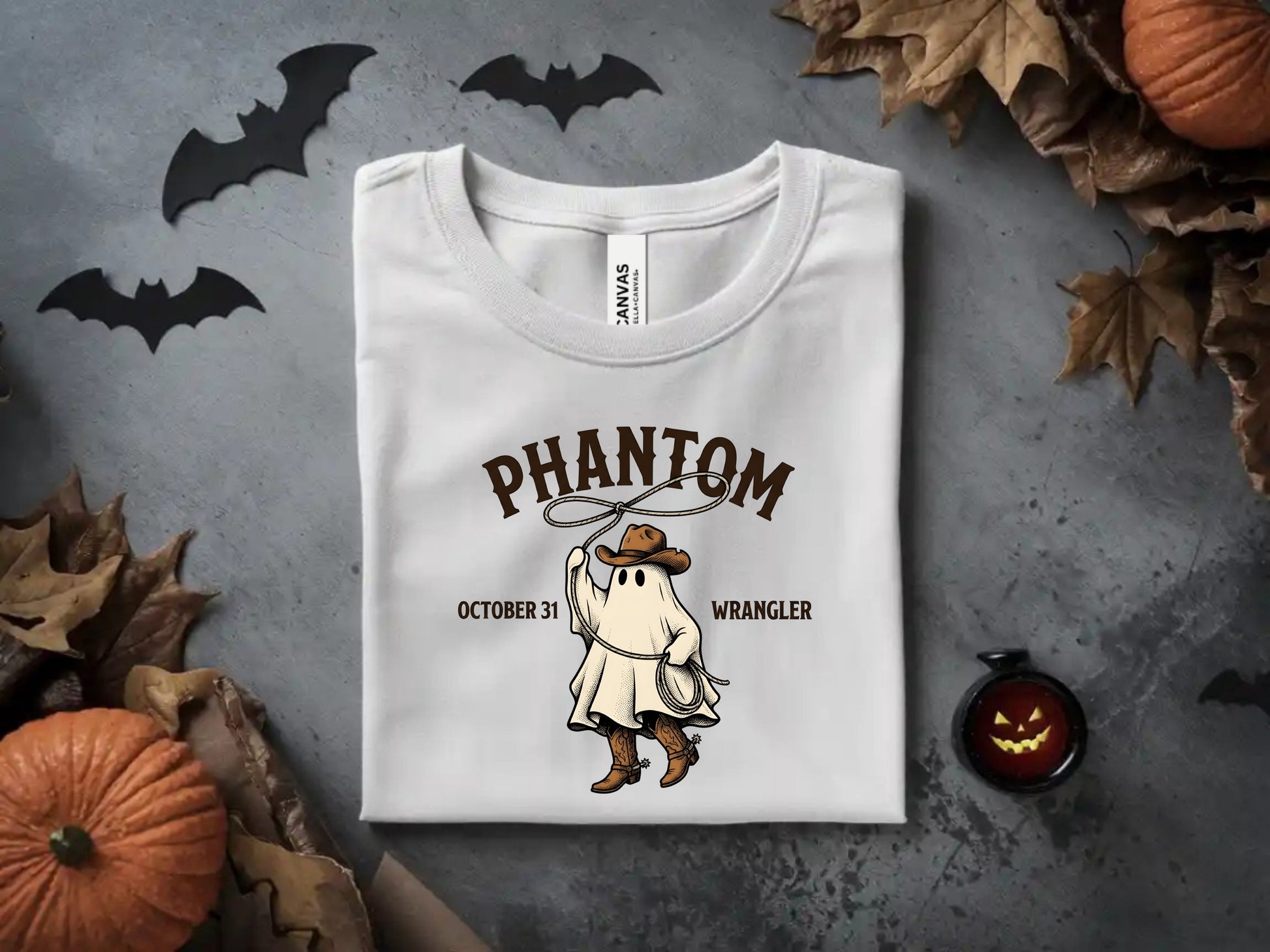 White t-shirt with ghost cowboy graphic: "Phantom Wrangler October 31".