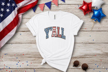 White t-shirt with "Y'ALL" in a patriotic flag design.