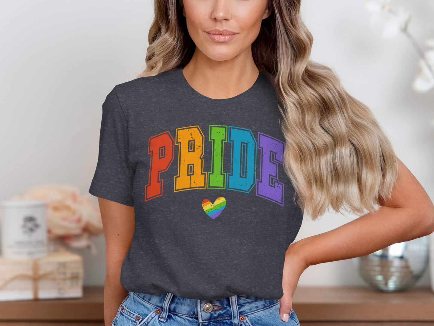 Charcoal t-shirt with "PRIDE" in rainbow letters and a rainbow heart.