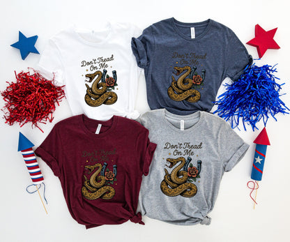 Four t-shirts with "Don't Tread On Me" and snake graphic.