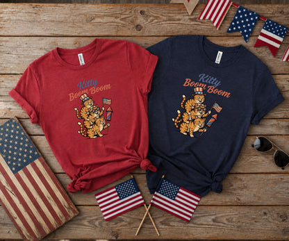 T-shirts with "Kitty Boom Boom" text and patriotic cat graphics.