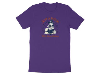 Purple t-shirt with a witch baking design and text.