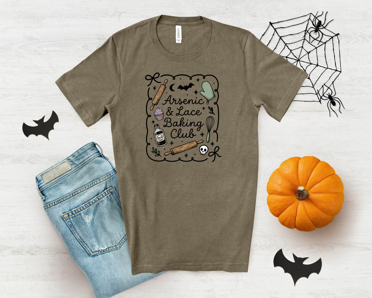 Brown t-shirt with "Arsenic & Lace Baking Club" text and Halloween-themed graphics.