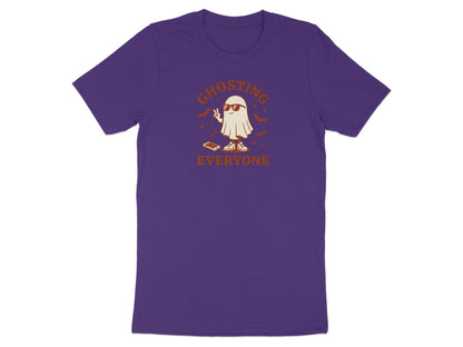 Ghosting Everyone graphic on a purple t-shirt with a ghost making peace sign.