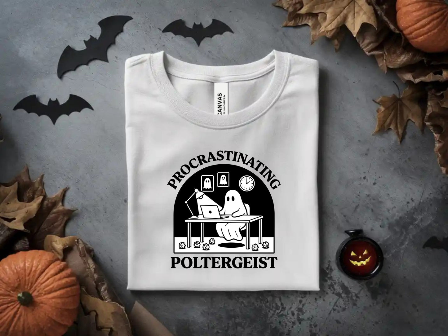 White t-shirt with "Procrastinating Poltergeist" text and ghost at a desk design.
