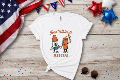 White t-shirt with cartoon firecracker and bottle with "Red White & Boom".