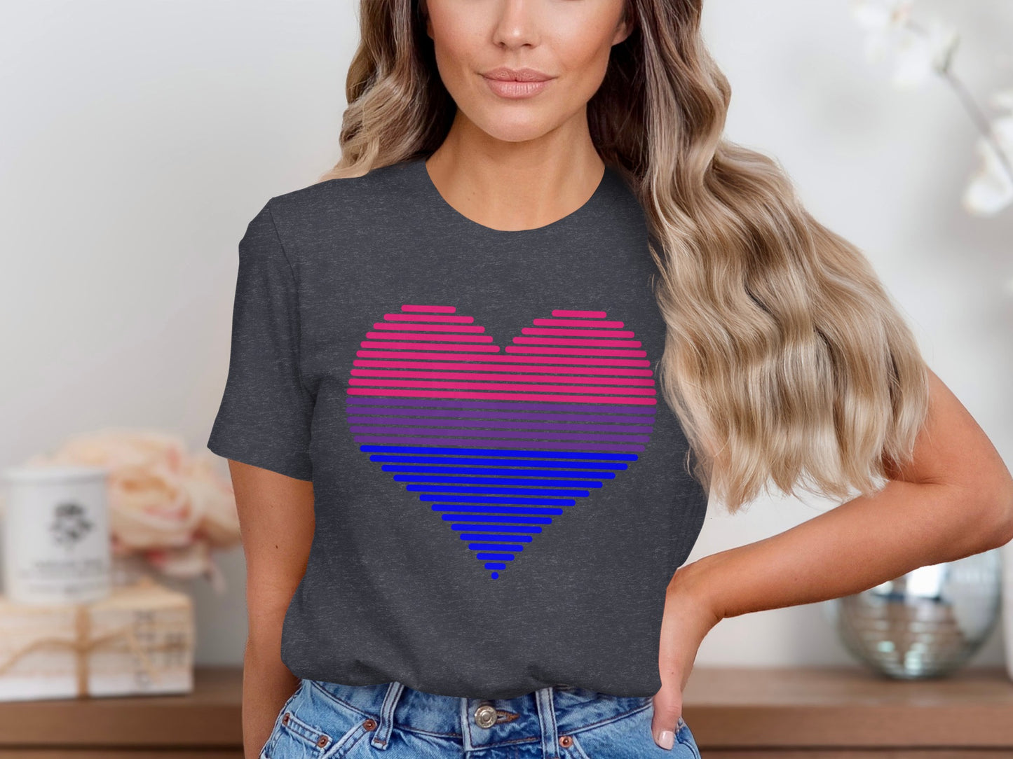 Dark t-shirt with a striped bisexual heart design.