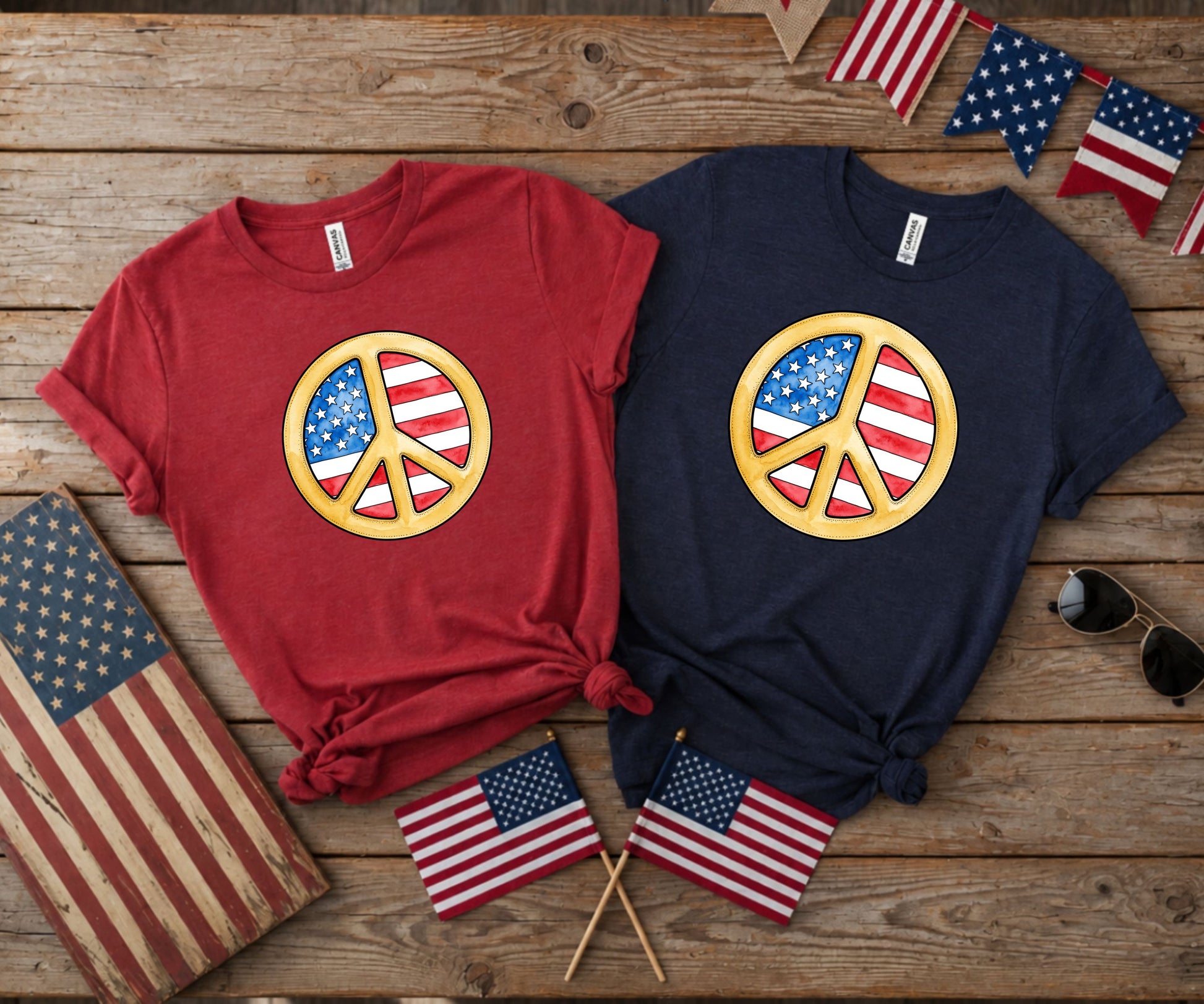 Two t-shirts with patriotic peace signs, American flags, and sunglasses.