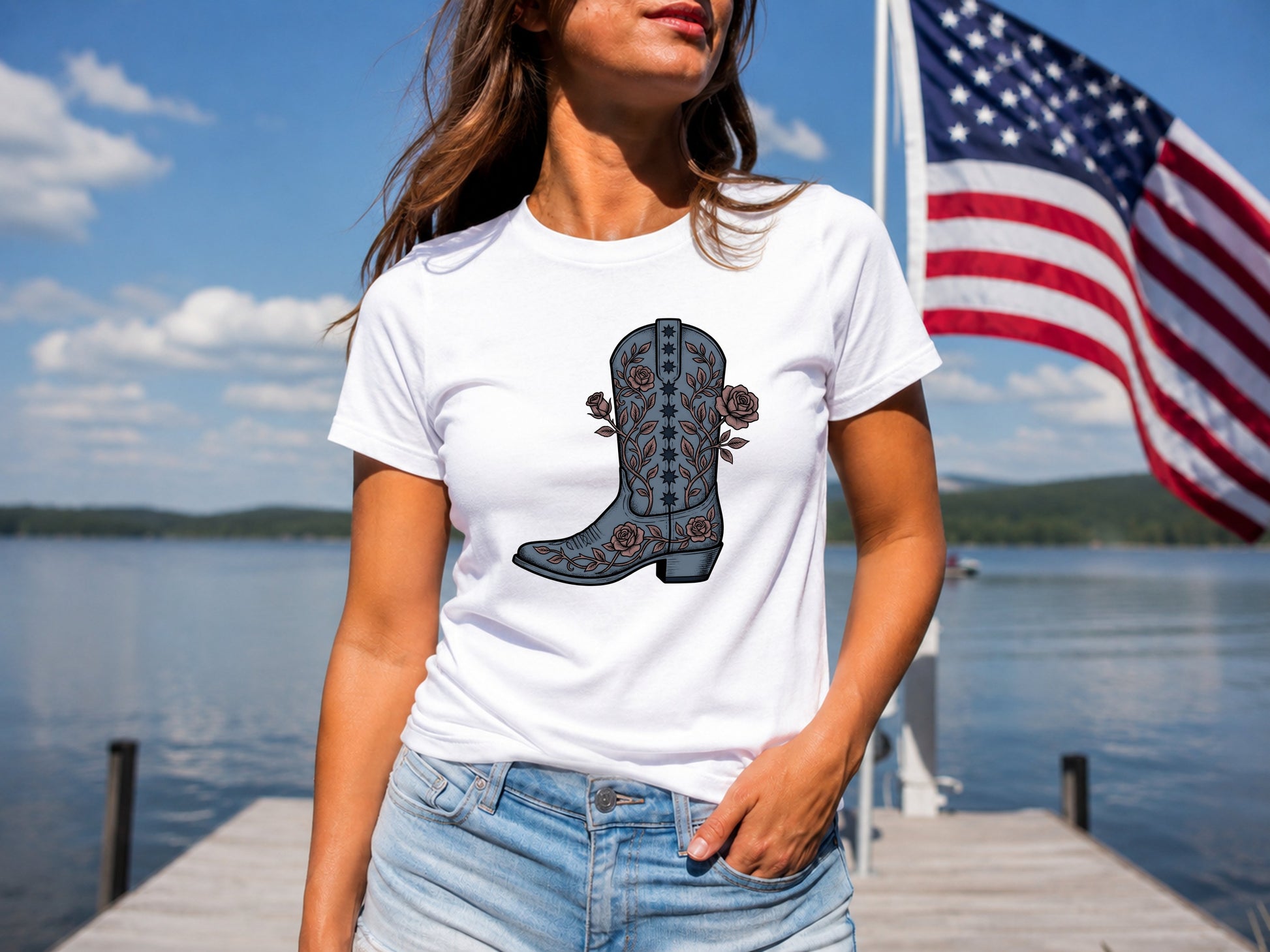 White t-shirt with a blue and pink floral cowboy boot graphic.