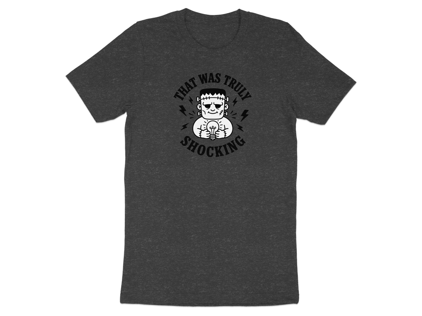 Dark t-shirt with Frankenstein holding a light bulb, text "That Was Truly Shocking".
