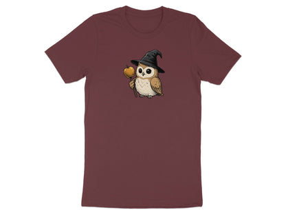 T-shirt with illustration of a cute owl wearing a witch hat and holding an apple on a stick.