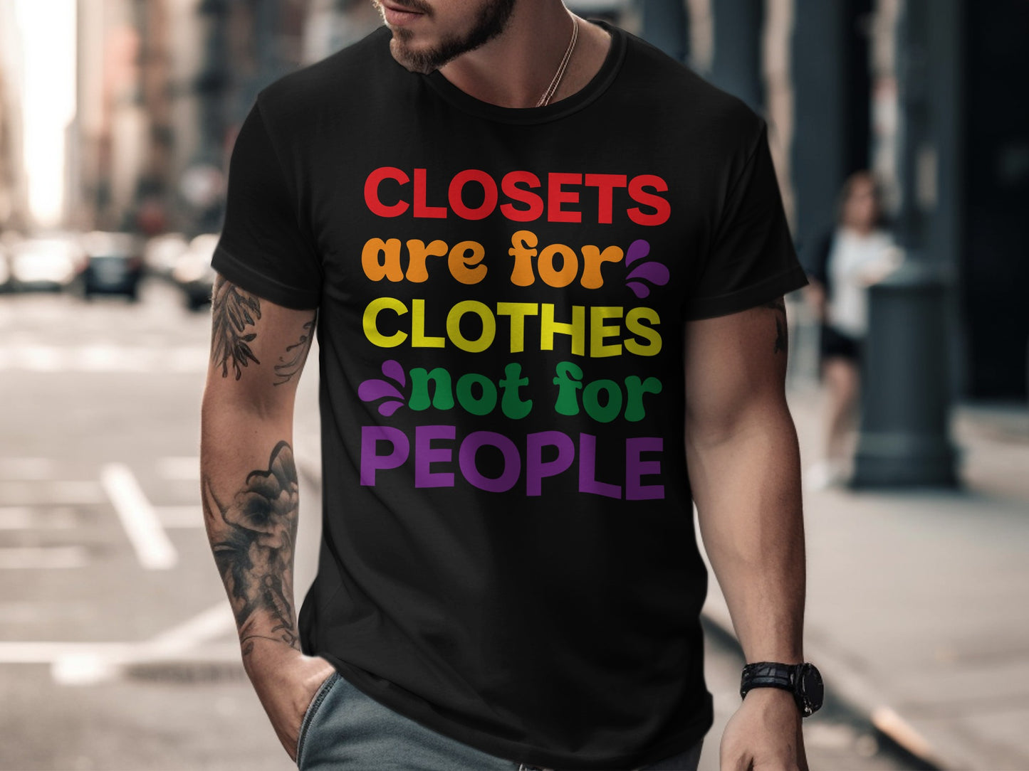 Black t-shirt with "closets are for clothes not for people" in rainbow text.