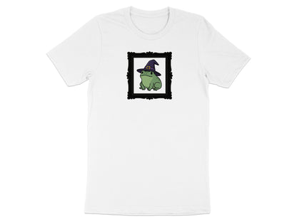 White t-shirt with a framed graphic of a green frog wearing a witch hat.