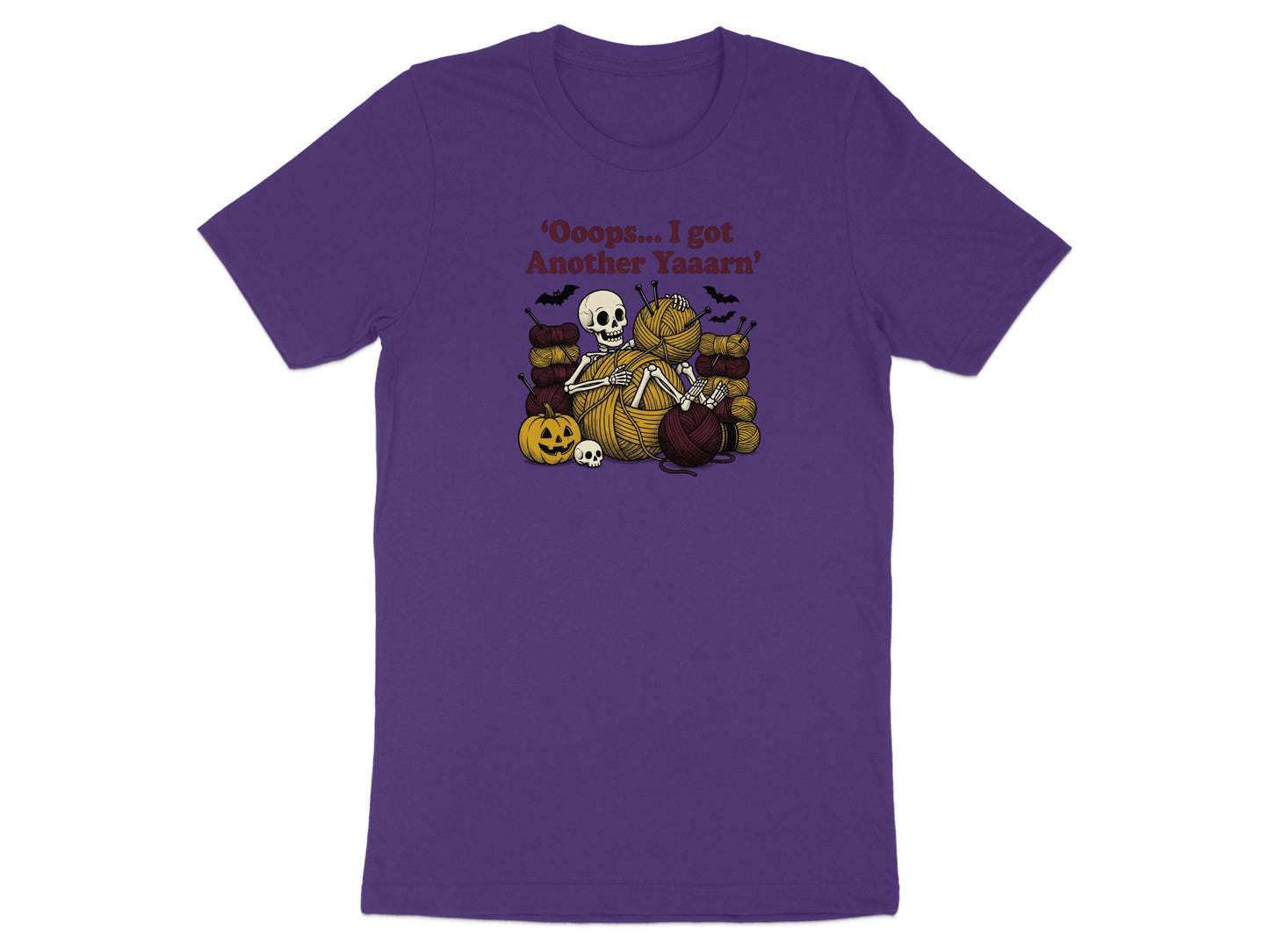 Skeleton surrounded by yarn, bats, and a pumpkin with text "Oops... I got Another Yaaarn".