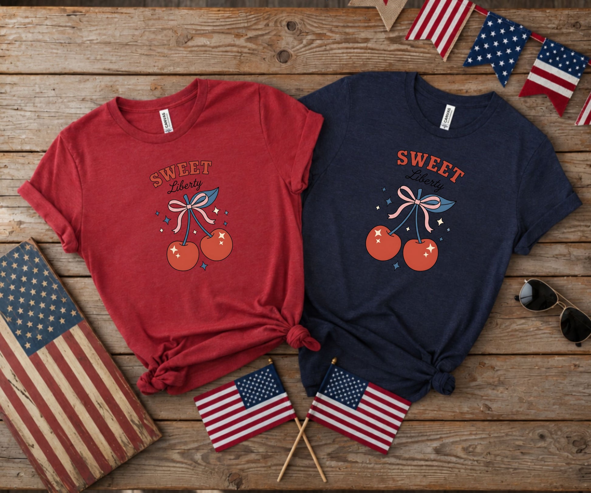 Two t-shirts, red and navy, with cherry and "Sweet Liberty" graphic.