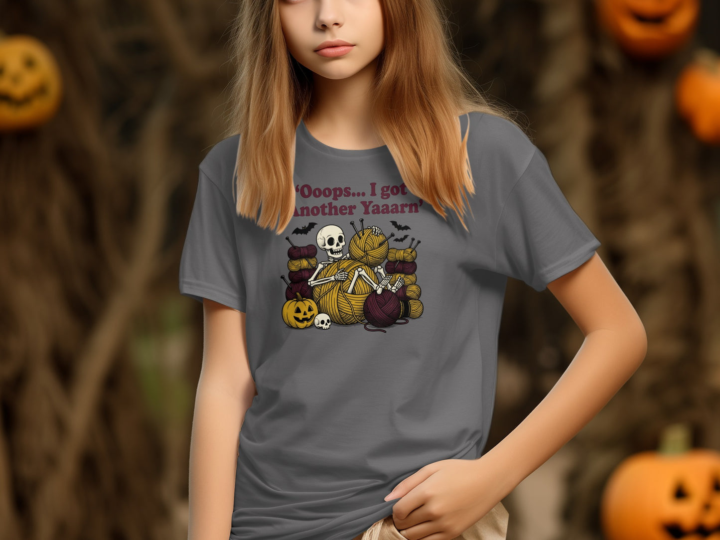 Grey t-shirt on girl with 'Oops...I got another Yaaarn' text and skeleton knitting.