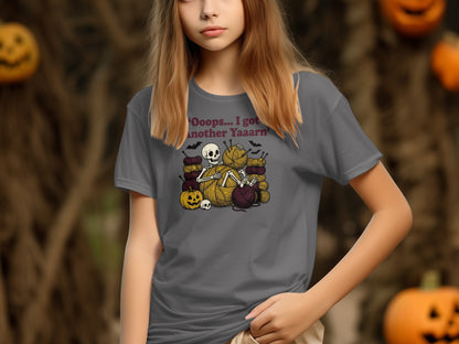 Grey t-shirt on girl with 'Oops...I got another Yaaarn' text and skeleton knitting.