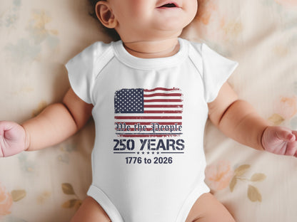 Baby in white onesie with American flag and "We the People 250 Years 1776 to 2026" text.