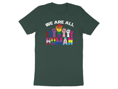 Dark t-shirt with "WE ARE ALL HUMAN" text in rainbow and transgender pride colors.
