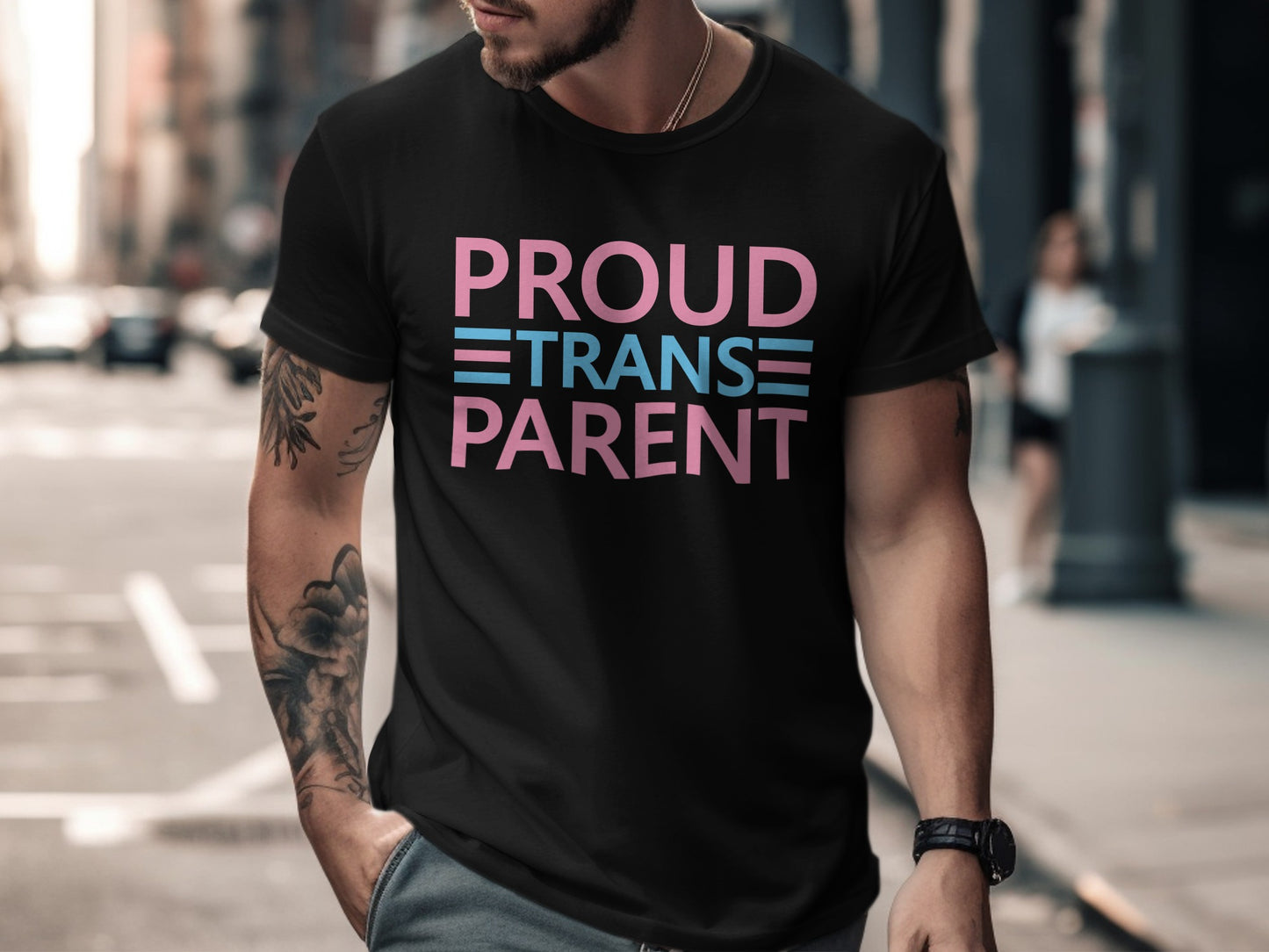 Black t-shirt with "PROUD TRANSGENDER PARENT" text in pink and blue.