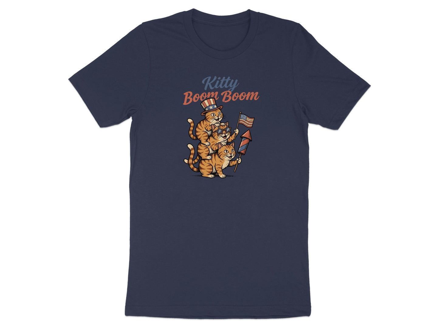 Two cartoon cats in patriotic hats with fireworks, on a navy t-shirt with "Kitty Boom Boom" text.