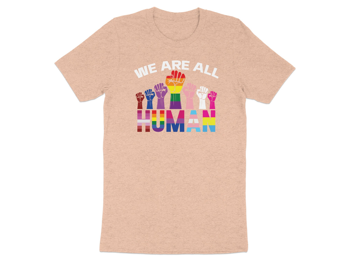 Rainbow pride fists above text "WE ARE ALL HUMAN" on a peach t-shirt.