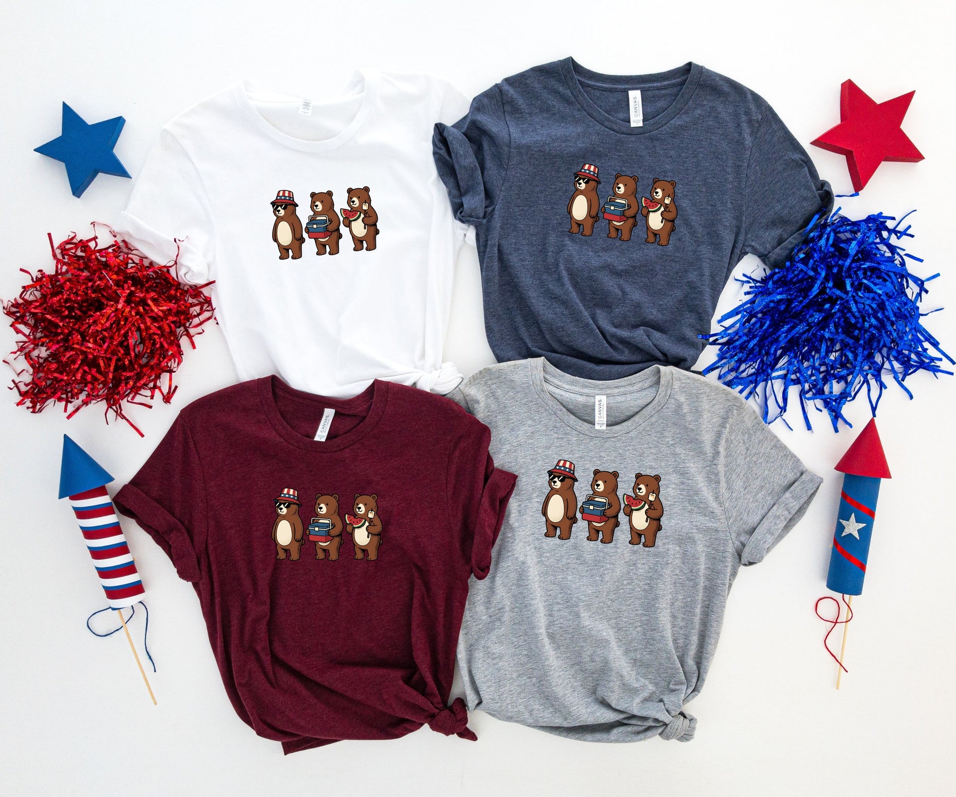 Four t-shirts featuring cartoon bears with patriotic hats and books.