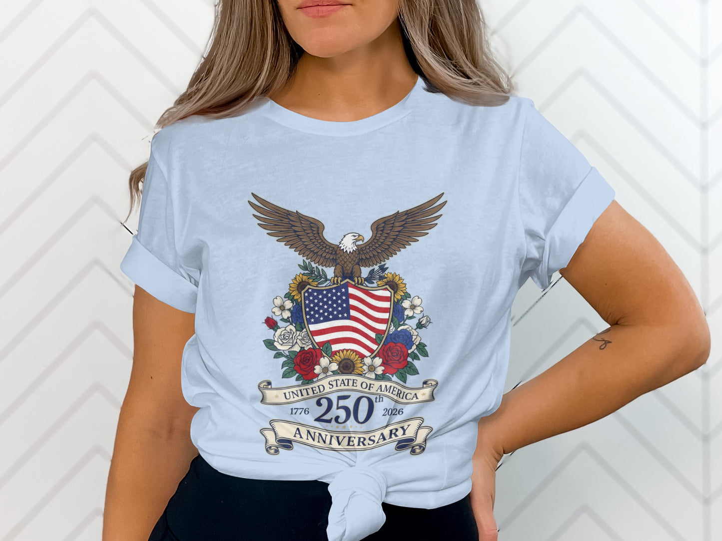 Light blue t-shirt with United States 250th Anniversary eagle and shield design.